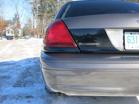 2001 Ford Crown Victoria - Rear view of a 2001 Ford Crown Victoria Police Interceptor parked in the snow.