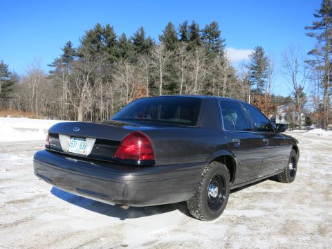 2001 Ford Crown Victoria - Rear view of a 2001 Ford Crown Victoria sedan in a snowy, wooded area.