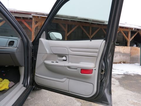 2001 Ford Crown Victoria - Interior view of the driver's side door panel on a 2001 Ford Crown Victoria.