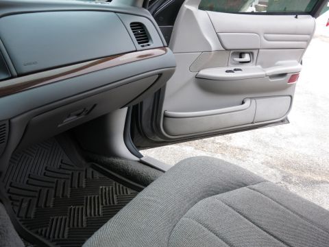 2001 Ford Crown Victoria - Interior view of a 2001 Ford Crown Victoria, highlighting the dashboard and door panel details.