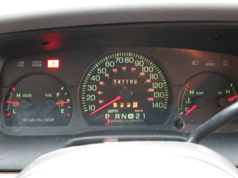 2001 Ford Crown Victoria - Interior view of dashboard gauges, including speedometer, fuel, and temperature indicators.