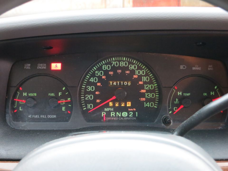 2001 Ford Crown Victoria dashboard showing 141,109 miles, 52 mph, and P R N D 2 1 gear selection