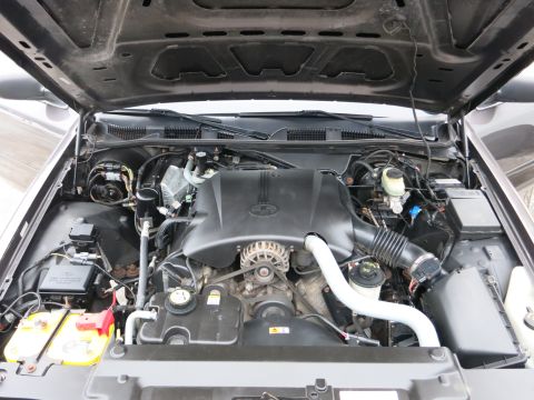 2001 Ford Crown Victoria - The engine bay of a 2001 Ford Crown Victoria is visible with the hood open.
