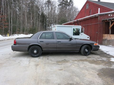 2001 Ford Crown Victoria - Side view of a 2001 Ford Crown Victoria sedan parked outdoors in winter.