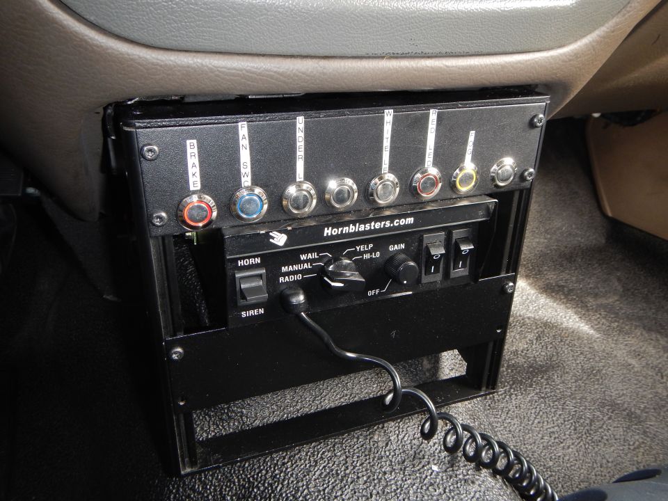 Black Hornblasters control panel with labeled toggle switches mounted under a dash