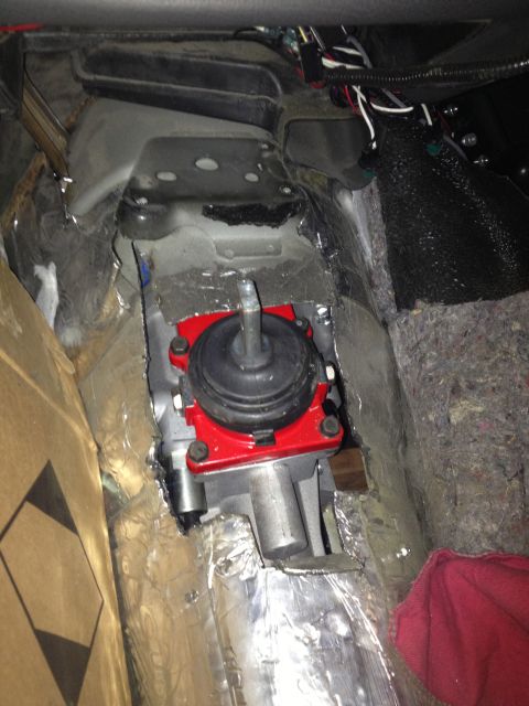 2004 Ford Crown Victoria - Manual transmission shifter assembly installed in a vehicle's floor, likely during a swap.