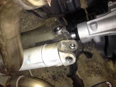 2004 Ford Crown Victoria - Underside view of a vehicle's driveshaft and exhaust system, possibly indicating a transmission swap.