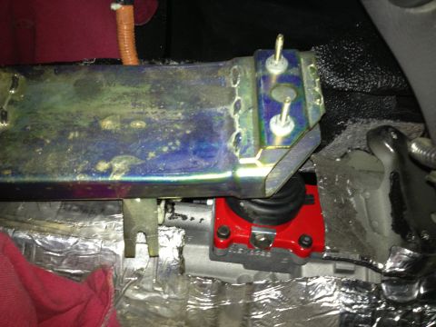 2004 Ford Crown Victoria - Aftermarket shifter assembly installed in a vehicle's transmission tunnel.