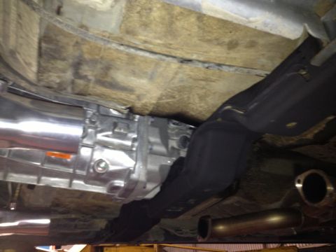 2004 Ford Crown Victoria - The photo shows the underside of a vehicle, focusing on the transmission and exhaust components.
