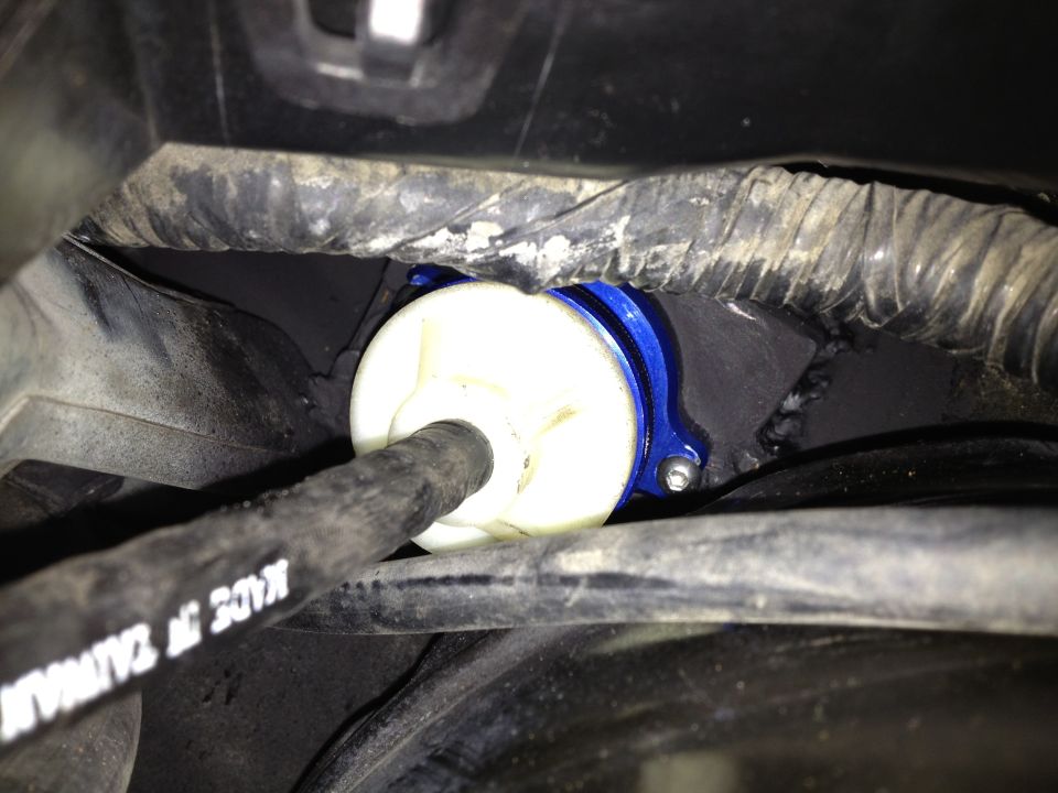 Blue anodized part with white cylinder and black hose, 'MADE IN TAIWAN' visible on hose