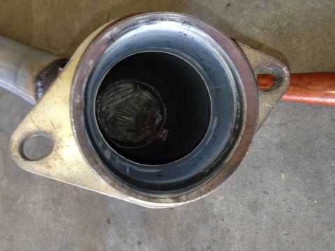 2010 Dodge Challenger - Close-up of an exhaust pipe flange showing the internal structure of a catalytic converter.