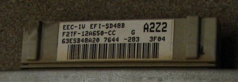 1990 Ford Bronco - Close-up of a Ford EEC-IV engine control module with part numbers visible.