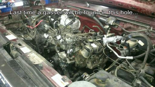 Engine bay with complex wiring and components