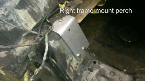 1996 Ford Bronco - A metal bracket is attached to the vehicle's frame, identified as the right frame mount perch.