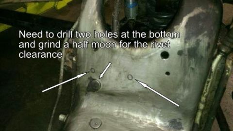 1996 Ford Bronco - Instructions indicate drilling two holes and grinding for rivet clearance on a metal component.