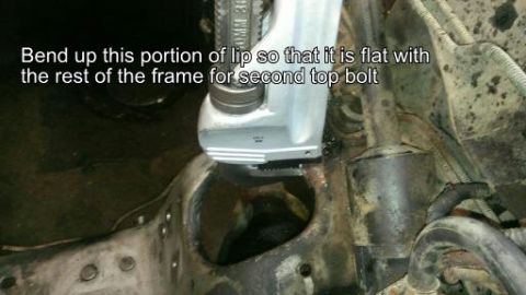 1996 Ford Bronco - Tool being used to bend a lip on a vehicle frame for a bolt. Instructions are overlaid on the image.