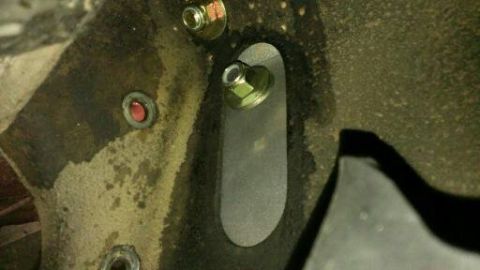 1996 Ford Bronco - Bolts are visible on the vehicle's frame, along with a red indicator light.