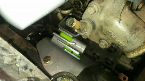 1996 Ford Bronco - Engine part with a bubble level installed for alignment or measurement.