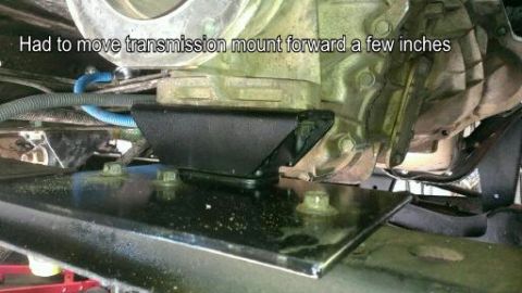 1996 Ford Bronco - A modified transmission mount is shown from underneath a vehicle.