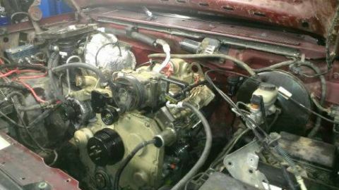 1996 Ford Bronco - Close-up view of an engine bay, showing mechanical parts and wiring.