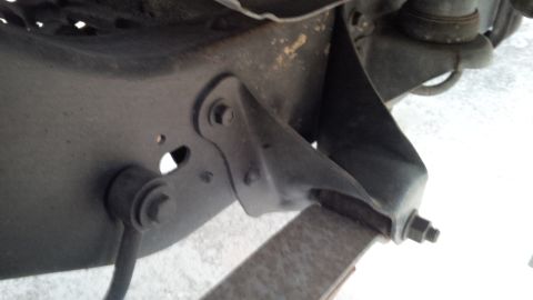 1992 Ford Bronco - Detail view of vehicle suspension components, showing a bracket and linkage, with a watermark visible.