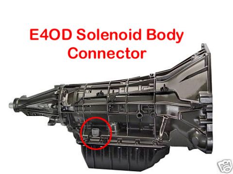 1990 Ford Bronco - Close-up view of an E4OD transmission solenoid body connector, indicated by a red circle.