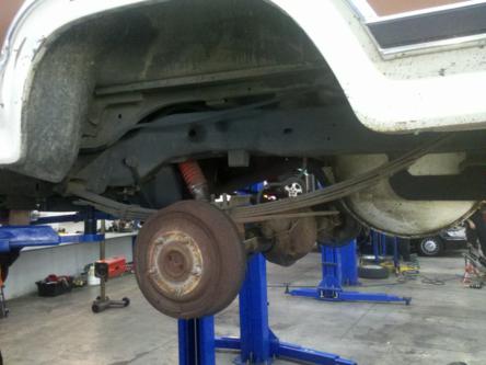 1982 Ford Bronco - Undercarriage view of a 1982 Ford Bronco, showing the rear axle and suspension system.