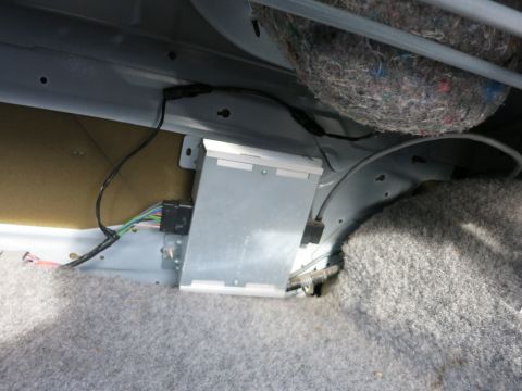 1991 Ford Crown Victoria LTD - Close-up of car interior wiring and insulation, no specific vehicle identified.