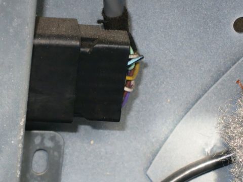 1991 Ford Crown Victoria LTD - A close-up view of a vehicle's electrical connector and its associated wiring harness.
