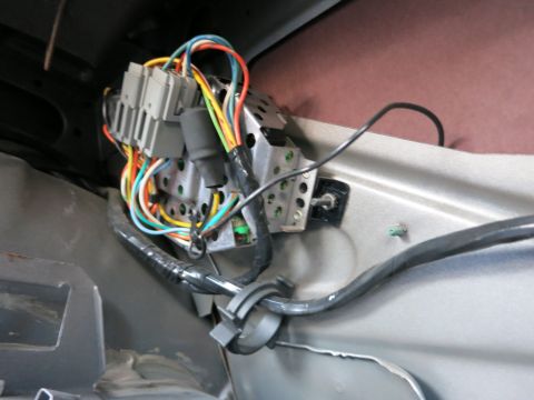 1991 Ford Crown Victoria LTD - Close-up view of a complex wiring harness and control module, likely part of a vehicle's electrical system.