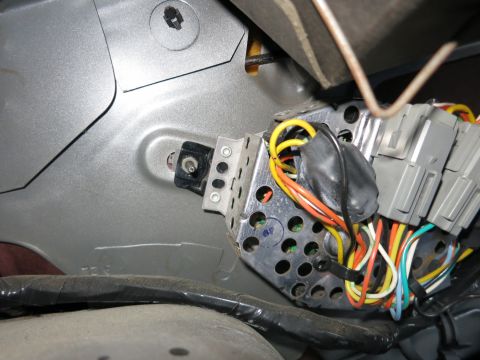 1991 Ford LTD Crown Victoria - A tangle of wires and connectors are visible, likely part of the vehicle's electrical system.