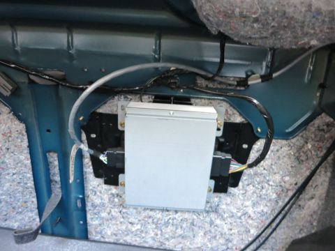 1991 Ford LTD Crown Victoria - Close-up of an electronic control unit installed in a vehicle's interior, likely for engine management or other systems.