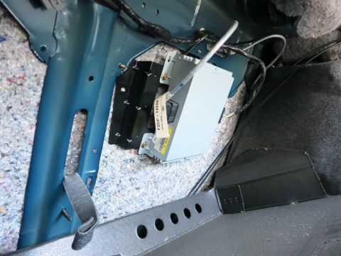 1991 Ford LTD Crown Victoria - Close-up of an electronic control unit with a label reading F2DF-14586, mounted inside a vehicle.