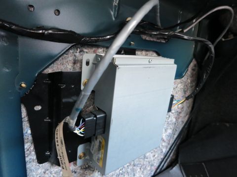 1991 Ford LTD Crown Victoria - Close-up of an electronic module and wiring located within the car's interior trim.