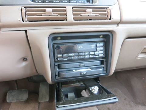 1991 Ford LTD Crown Victoria - Interior view of a 1991 Ford Crown Victoria LTD, focusing on the center console and dashboard.