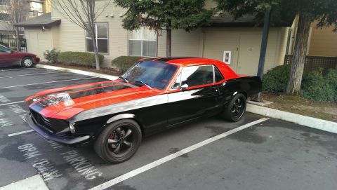 1987 Ford Bronco - This classic Mustang features a two-tone paint job with black and orange accents.
