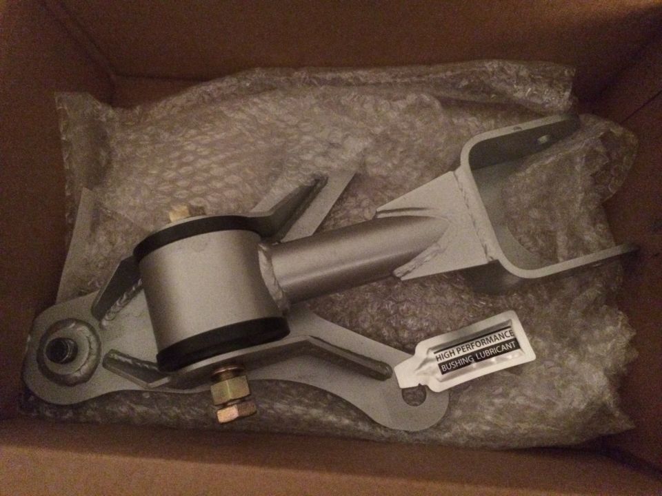 Engine mount part in box with lubricant packet. Supermotors.net logo visible