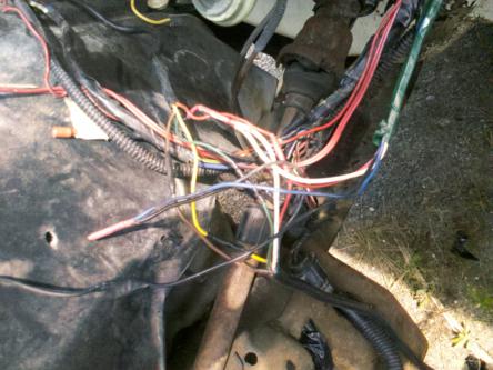 1982 Ford Bronco - A close-up view of a complex engine wiring harness with many colored wires.