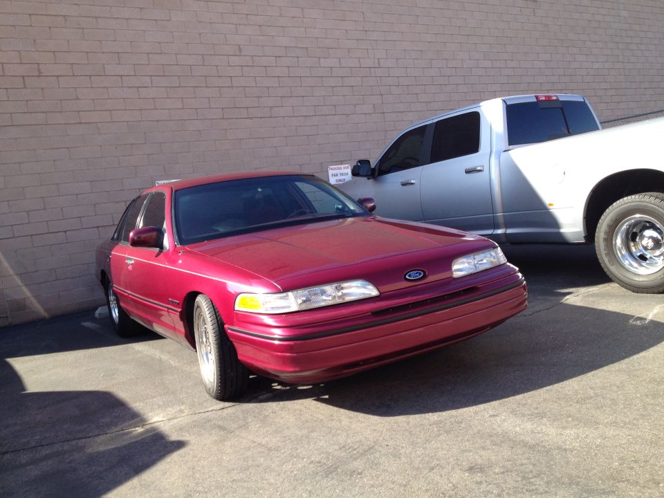 Red 1992 Ford Crown Victoria sedan, 3q-front view