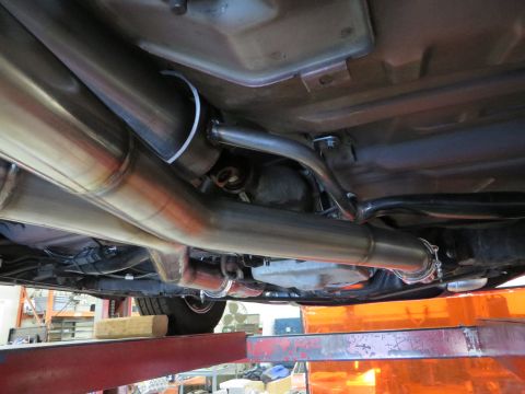 1992 Ford Crown Victoria - Custom exhaust system installation viewed from underneath the vehicle.
