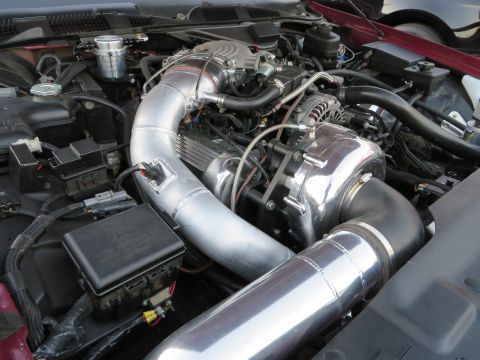 1992 Ford Crown Victoria - Close-up of a modified engine bay, showing a supercharger and custom intake.