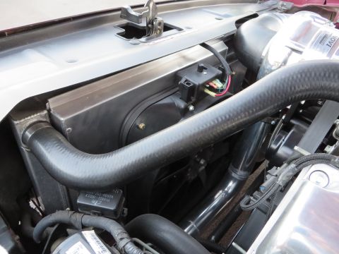 1992 Ford Crown Victoria - Close-up of engine components, including a supercharger and various hoses, under the hood.