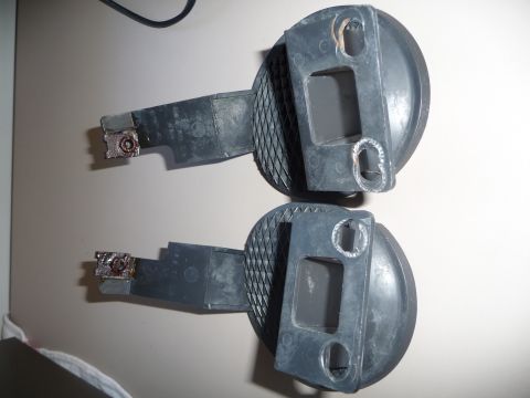 1993 Mazda MX-3 - Pair of automotive corner marker lights shown from the side, with visible mounting points and electrical contacts.