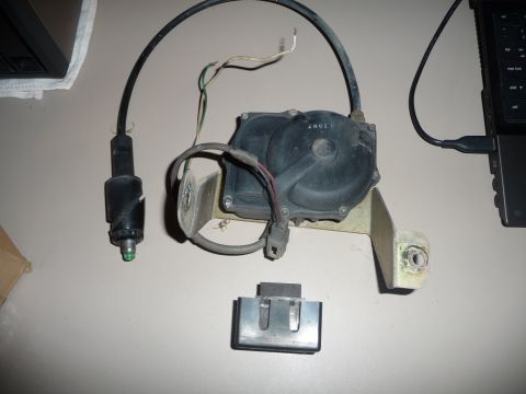 1993 Mazda MX-3 - This is an antenna motor and mast assembly. The part number '2001' is visible on the motor housing.
