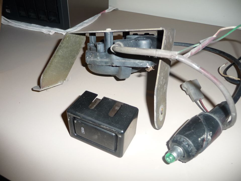 Automotive part with switch and motor assembly