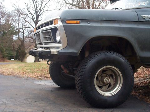 1979 Ford Bronco - This Ford Bronco features a distinctive grille and headlight design, along with off-road tires and a custom bumper.