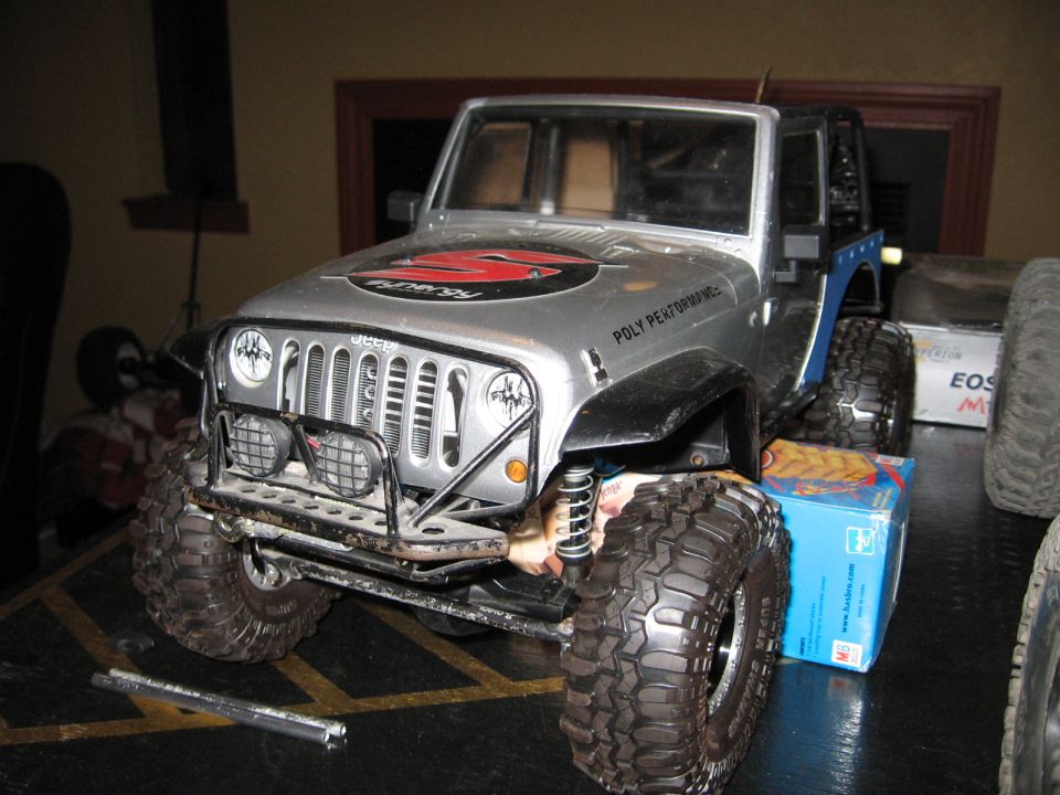 Silver toy Jeep Wrangler with "Poly Performance" text