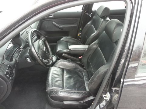 2002 Volkswagen Jetta - Interior view of a 2002 Volkswagen Jetta, black leather seats and dashboard details.
