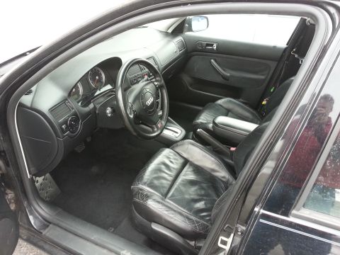 2002 Volkswagen Jetta - Interior view of a car with black leather seats and dashboard details.