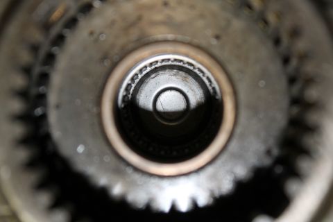 1995 Ford Bronco - Internal view of a transfer case component, showing gears and a bearing.